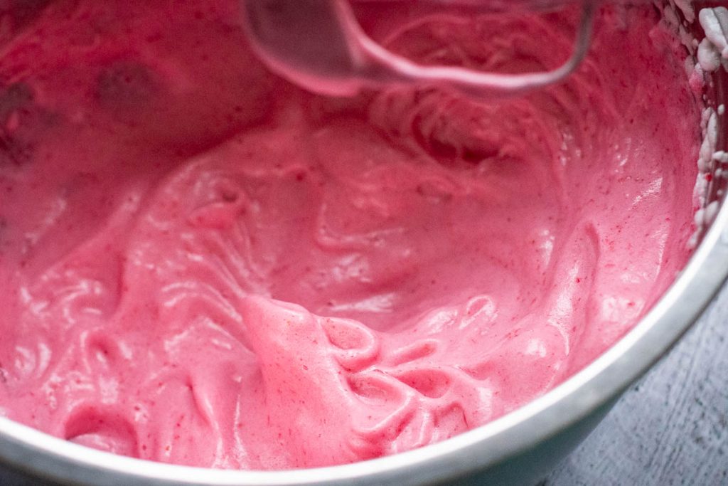 Cranberry and egg white mixture showing bright pink color.