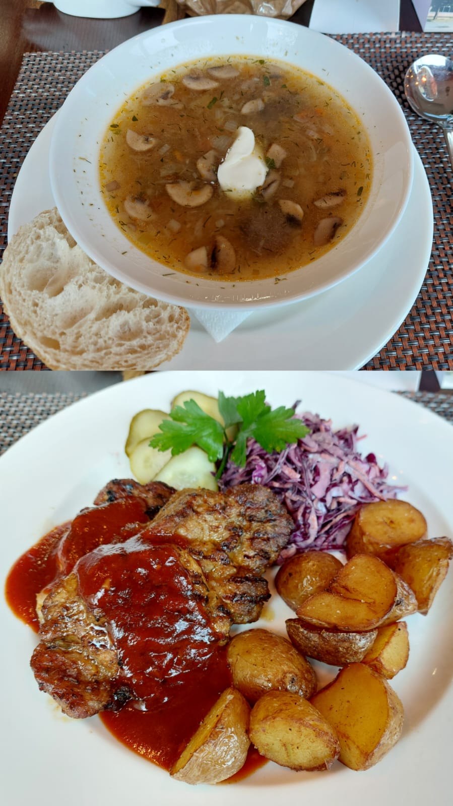 A weekday lunch meal deal in Lithuania including a bowl of soup and a pork chop with potatoes, salad, and pickles.