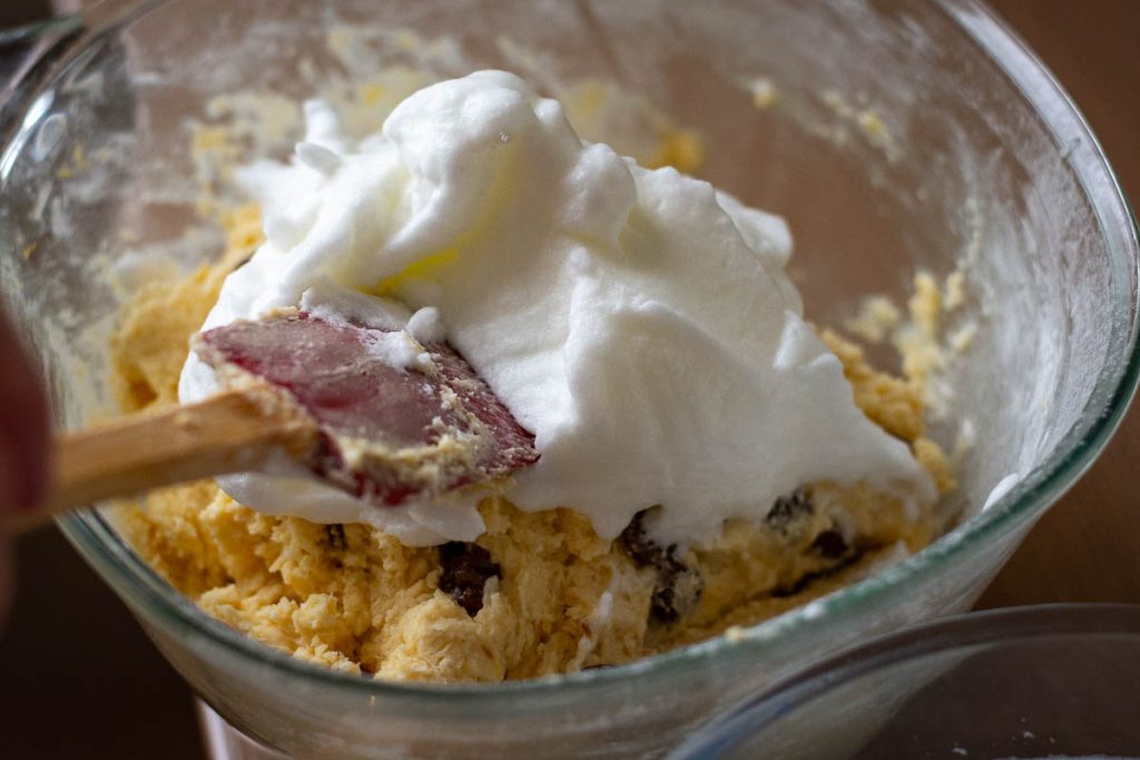 A third of egg whites being added to the Lithuanian cake batter.