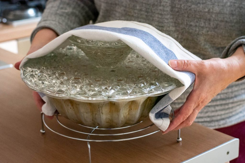 Turning the Easter cake onto a cake stand.