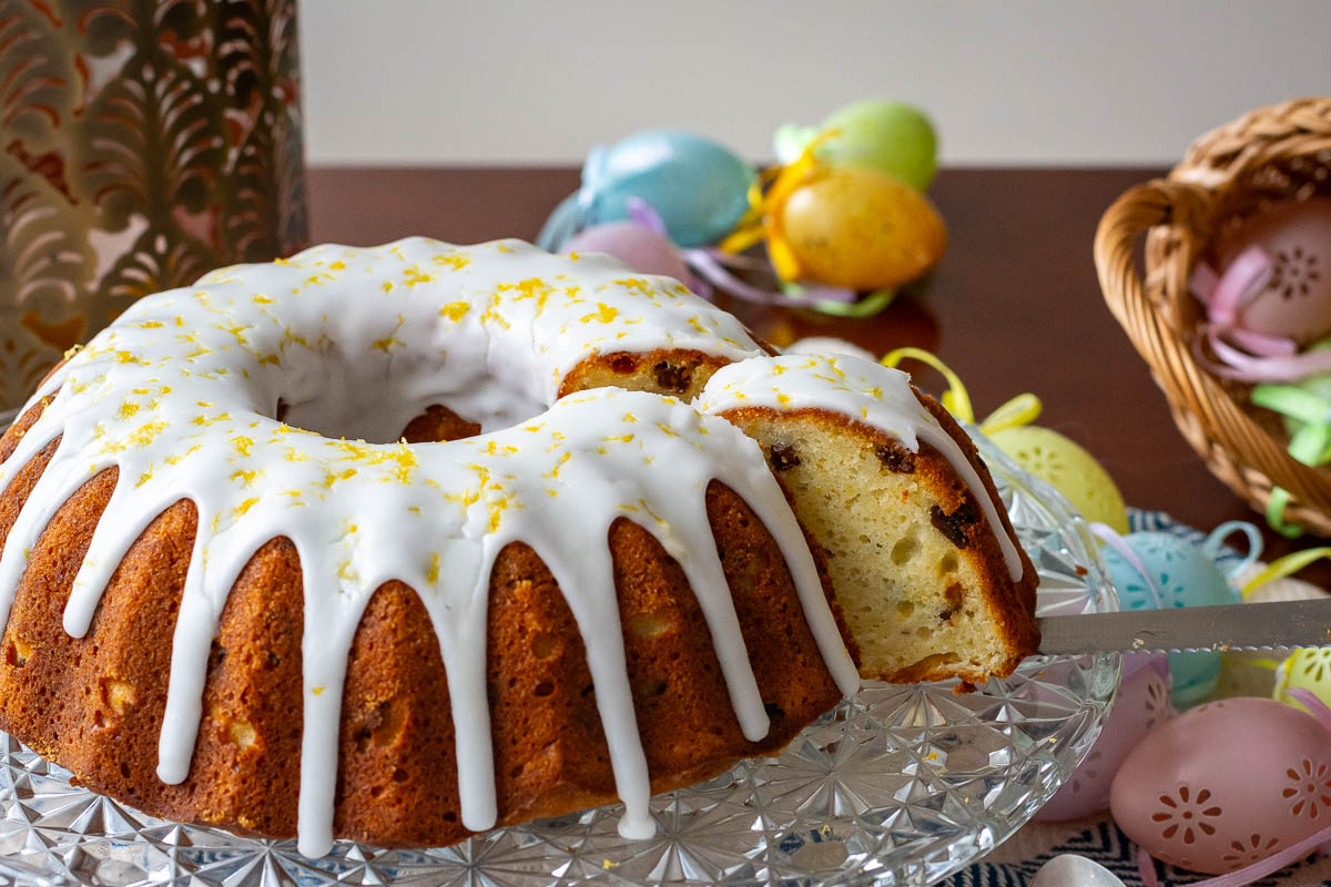 Cutting into a Lithuanian Easter cake.