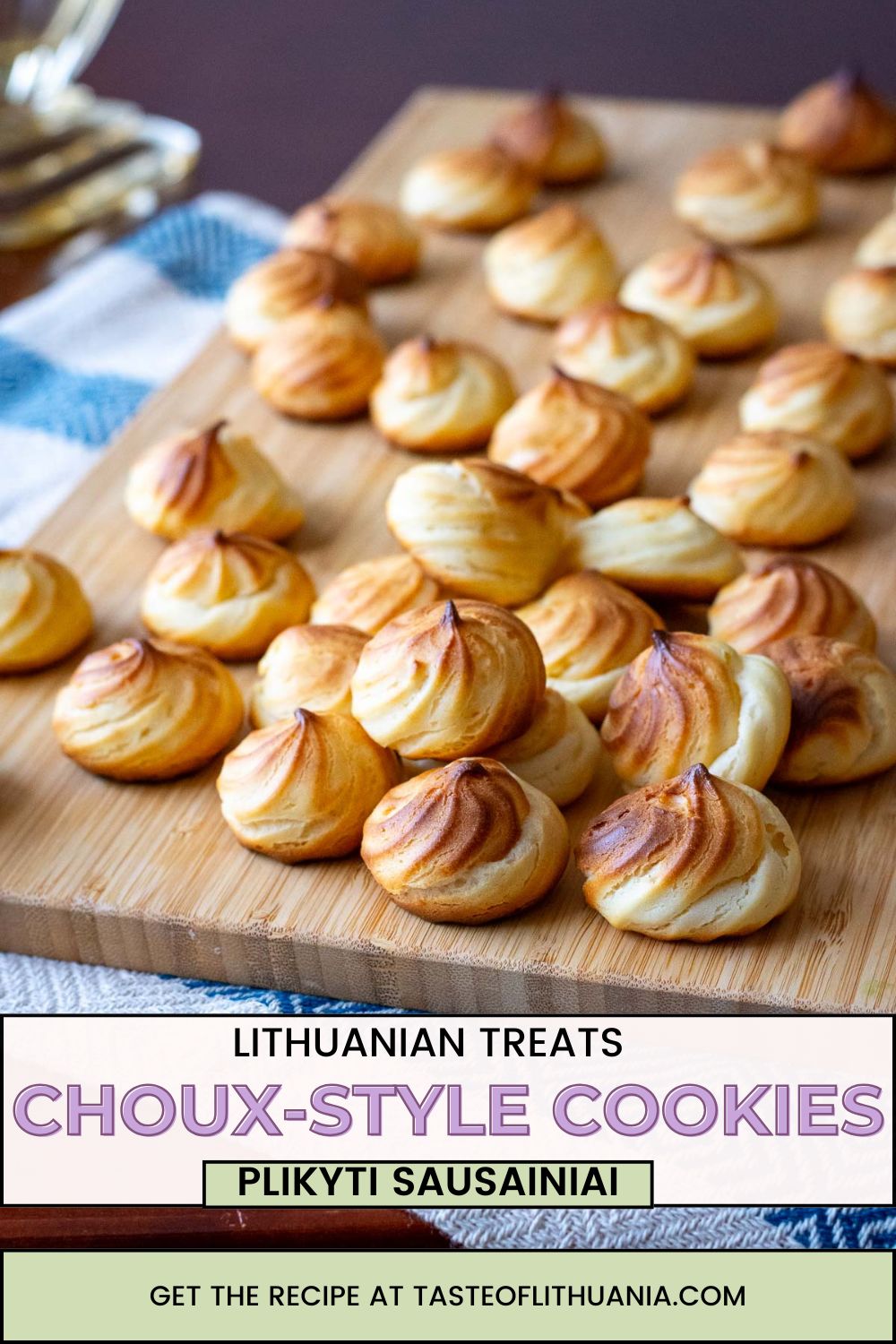 Choux-style Lithuanian cookies on a wooden board. Pin for Pinterest.