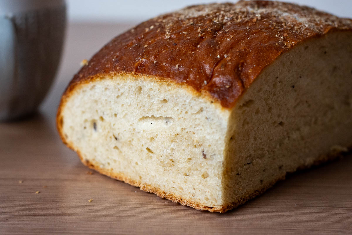 A quarter of Lithuanian bread loaf on a table. 
