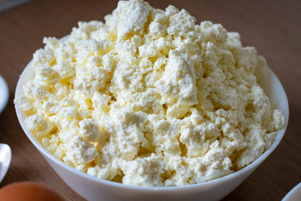 Lithuanian farmer's cheese, also known as curd cheese, in a white bowl.