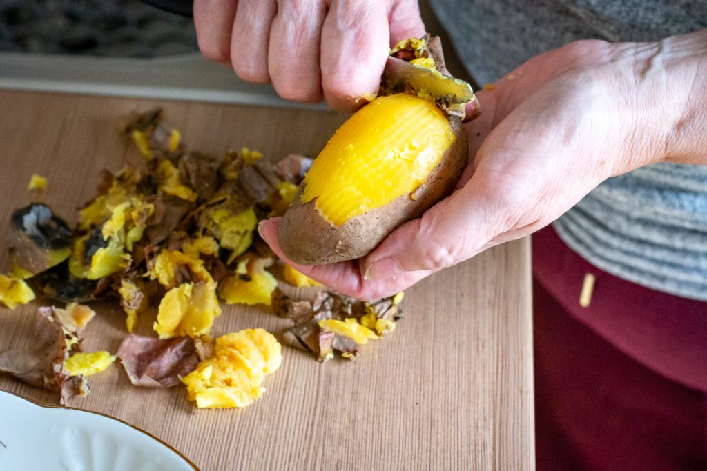 Peeling potatoes.