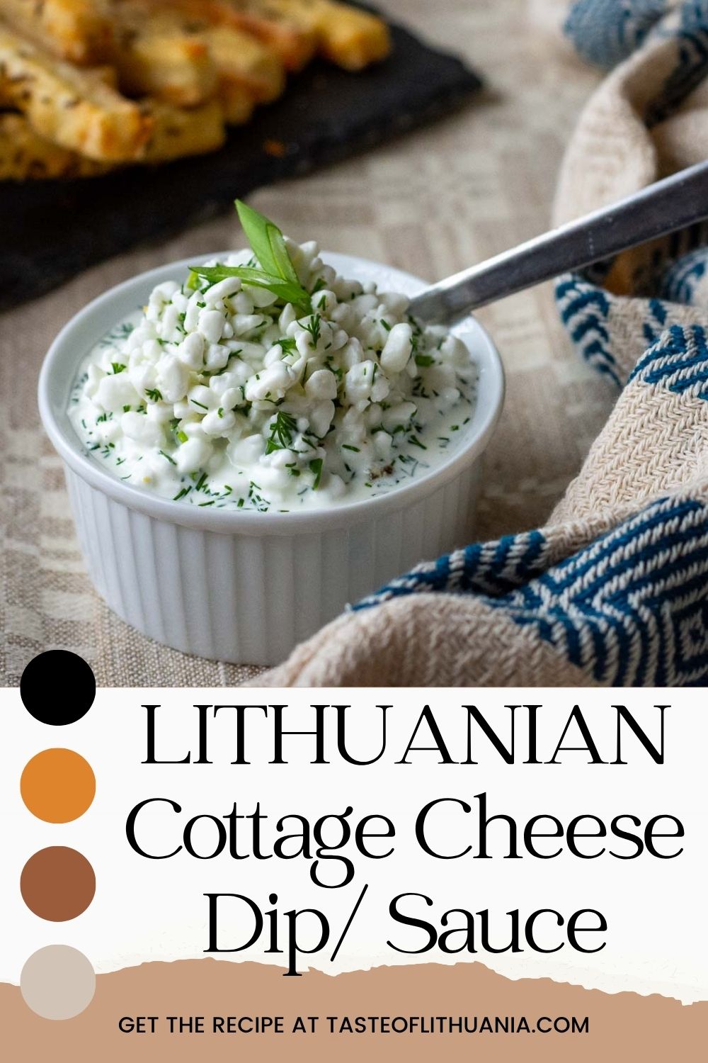 Lithuanian cottage cheese sauce for potato dishes in a small white ramekin with a spoon in it. Pin for Pinterest.
