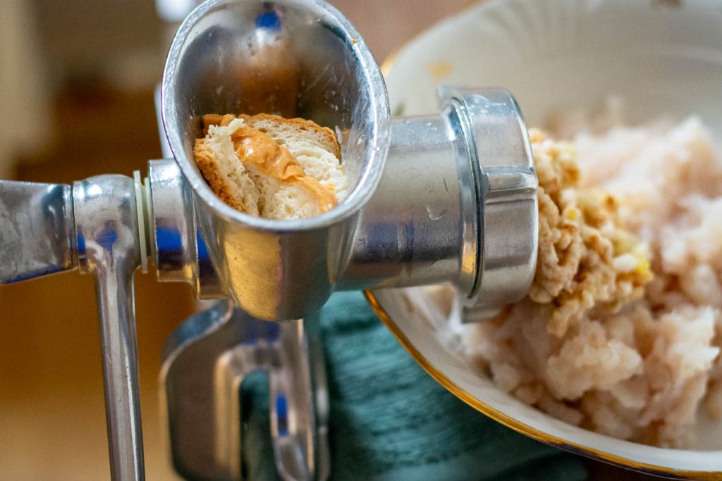 Mincing milk soaked bread.
