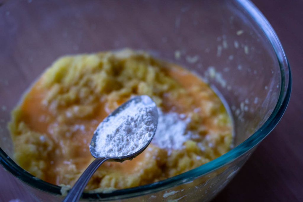 Flour being added to the potato mixture.
