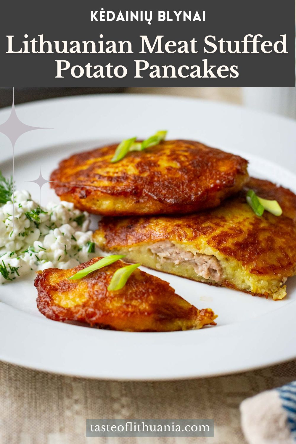Lithuanian meat stuffed potato pancakes on a white plate served with cottage cheese sauce. Pin for Pinterest.