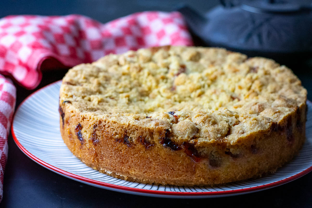 Lithuanian Plum cake on a large plate ready to be served.
