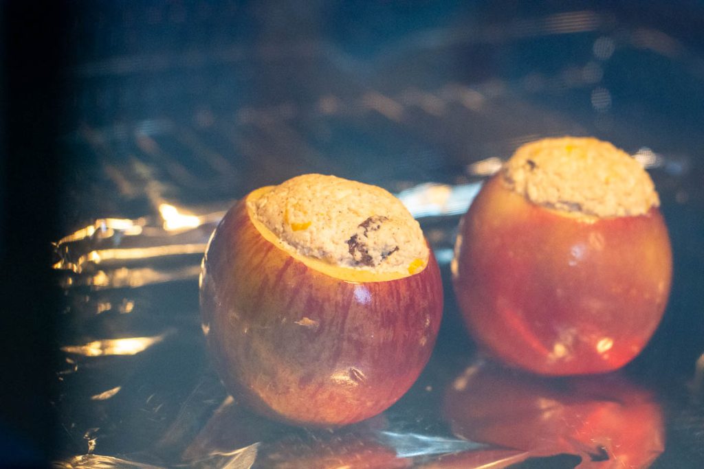 Farmer's cheese stuffed apples baking in the oven.