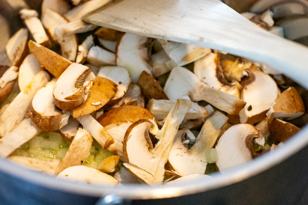 Sliced mushrooms in a frying pan. 