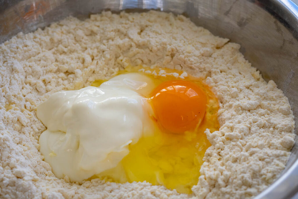Sour cream and egg added to the flour and butter mixture.