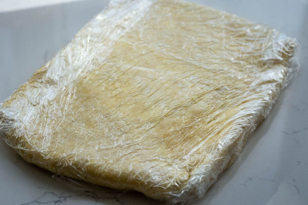 Flattened and wrapped cookie pastry.